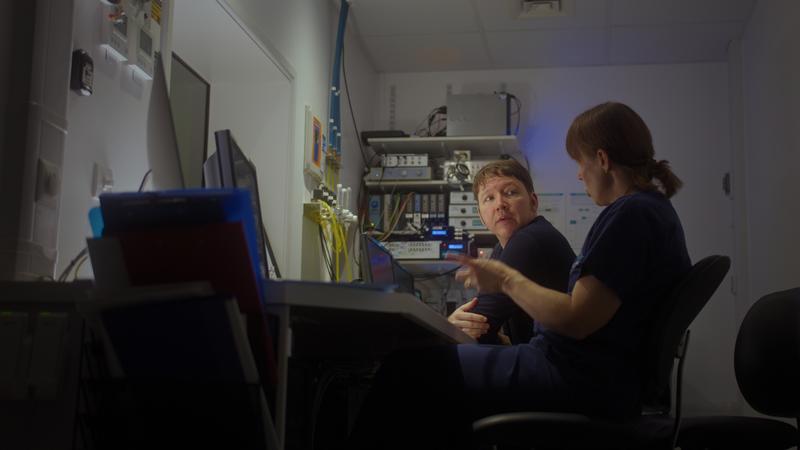 Juliet Semple discussing work with a colleague